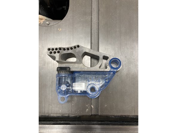 First, install the cartridge. Slide it into place, and then lock it with the red pin.