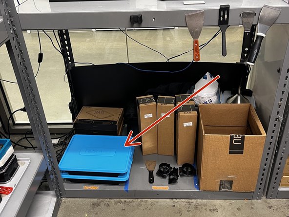 Retrieve one of the tank storage boxes from the Nexa storage area.