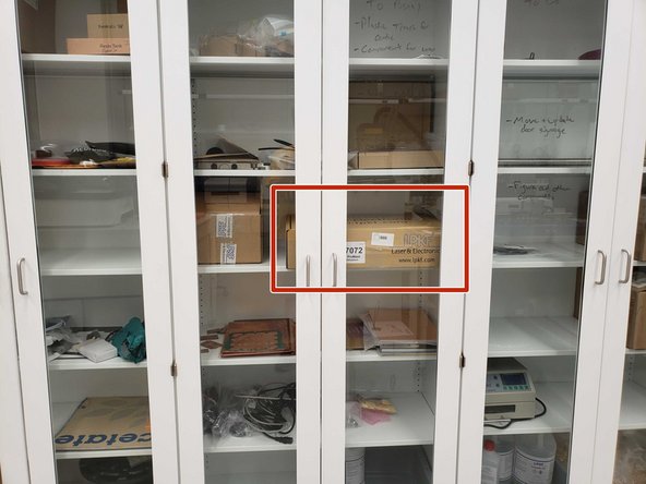 The solder mask/silkscreen kits are kept in a brown LPKF box in one of the tall white cabinets.