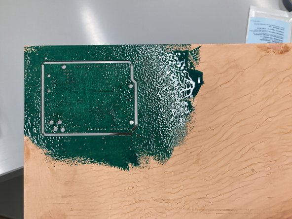 Once a thick layer of solder mask/silkscreen is present on both sides of the PCB it's time to cure it.