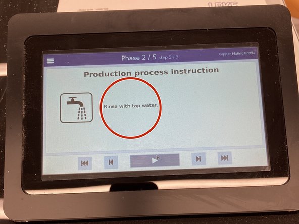 Once phase 2 is complete, remove the board from bath 2 and rinse it with tap water