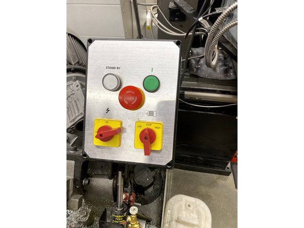 First, you turn the power knob on. Also, use this black knob and lever to hold your piece of stock firmly.