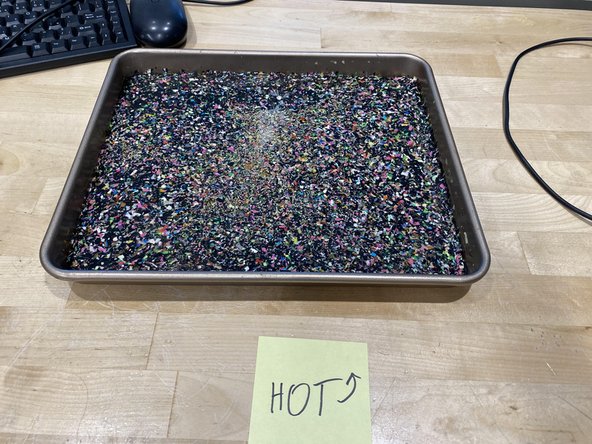 After 2 hours, carefully remove the baking tray from the oven and set it down somewhere flat and safe.