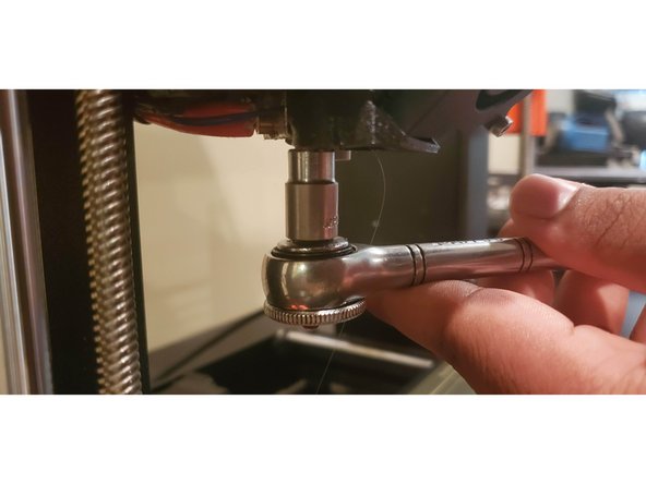 Hold the heatblock using the pliers/wrench