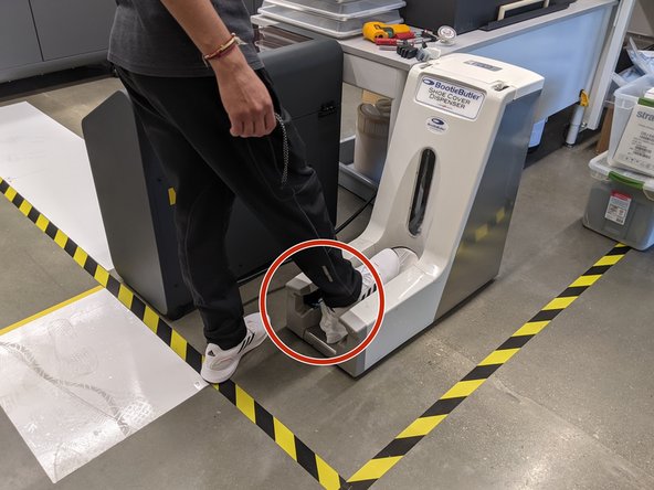 Insert heel of foot into bootie opening