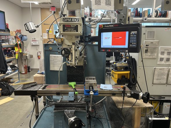 Use the pneumatic tool clamp to release the face mill bit and return it to its proper slot on the cart.