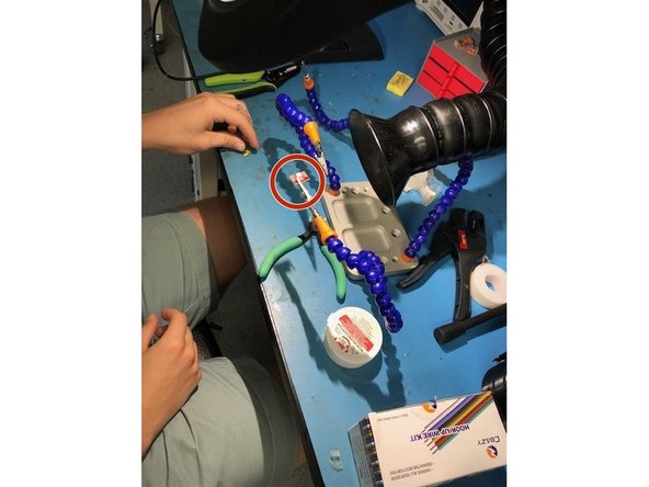 Attach the RGB LED to one of the helping hands so the sockets you are going to solder are facing away from you