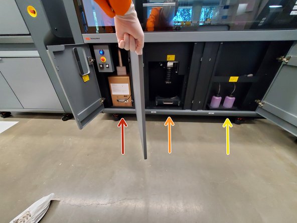 The left utility cabinet holds the binder cartridge and fines jar