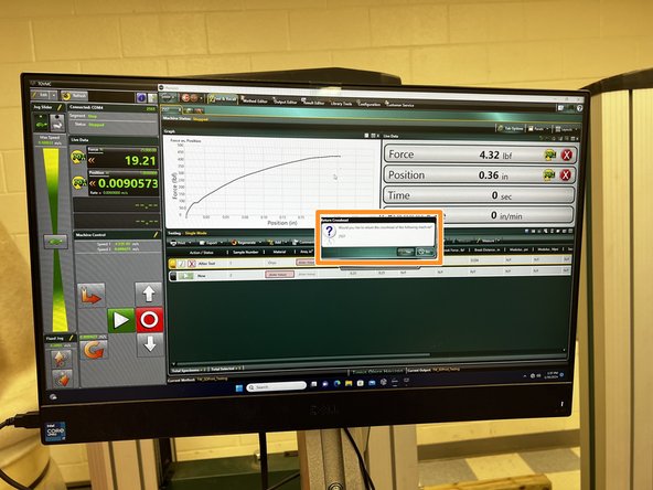 Once the test is stopped, a message will appear asking to return the crosshead. Select “No.” and remove the hook from the jaws.