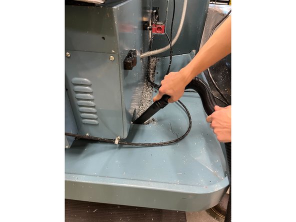 Use the vacuum to clean up all the chips inside the pan