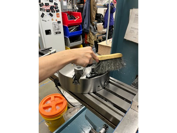 NOTE: It is best to clean this machine from top to bottom. Brush off all chips to the pan below or on the ground.