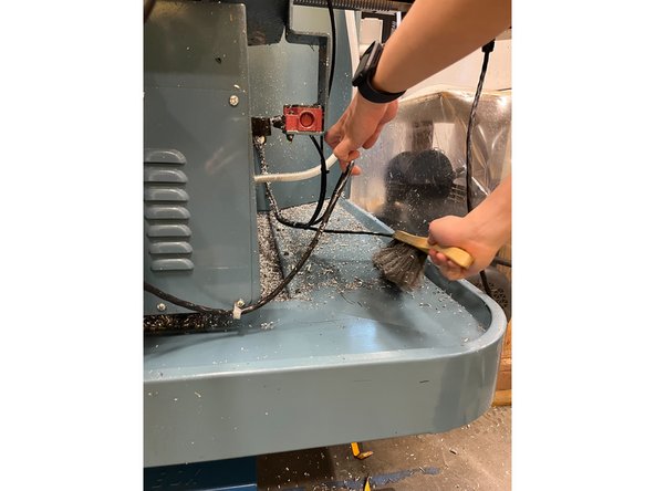 Use the brush the sweep all the chips into the innermost part of the pan on both sides.