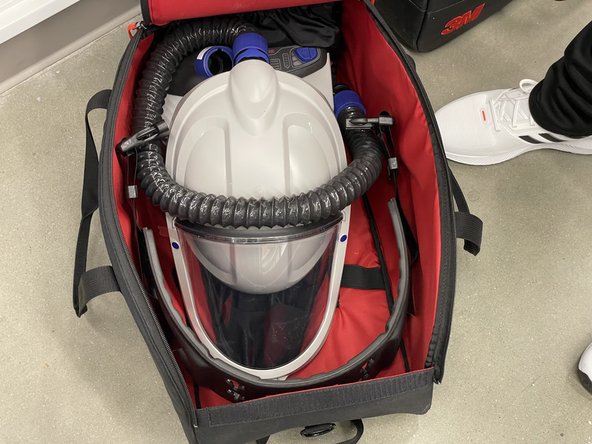 Clean outer surfaces of PAPR unit (avoid lens) with DI water and paper towel