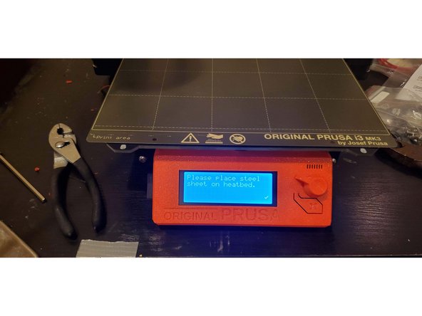 Return the build plate to the machine