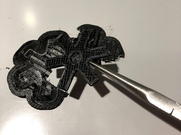 For simple prints, the raft will come off by using even force closest to the corner between the part and raft