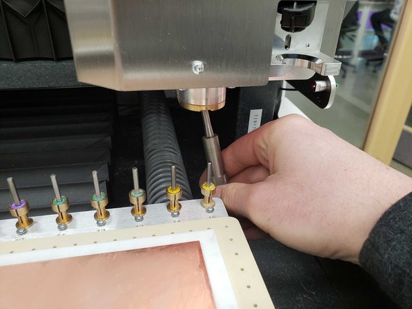 Insert the collet tool from the box into the spindle