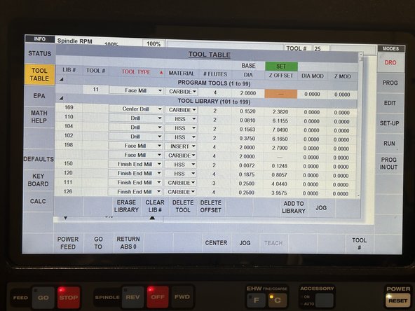 Now replace the tool head with the 4-flute face mill from the tool head tray using the pneumatic tool chuck.