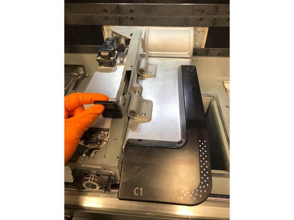 Pull the lamp release handle to disengage the lamp module from the printer