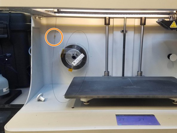 Carefully unwind two and a half feet of material from the spool