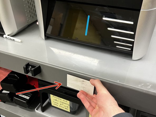 Wipe off the dry-erase tag and return it beneath the XiP.