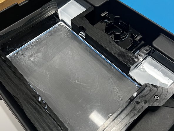 Use a paper towel to gently wipe away the remaining resin on the fragile membrane.