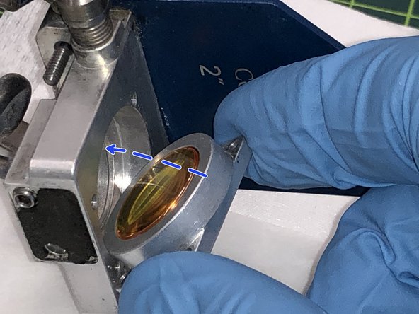 Carefully reinstall the lens holder back into the carriage