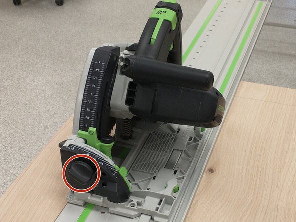 The track saw can make tapered cuts. To angle the blade first loosen the lock knob on the front of the machine.