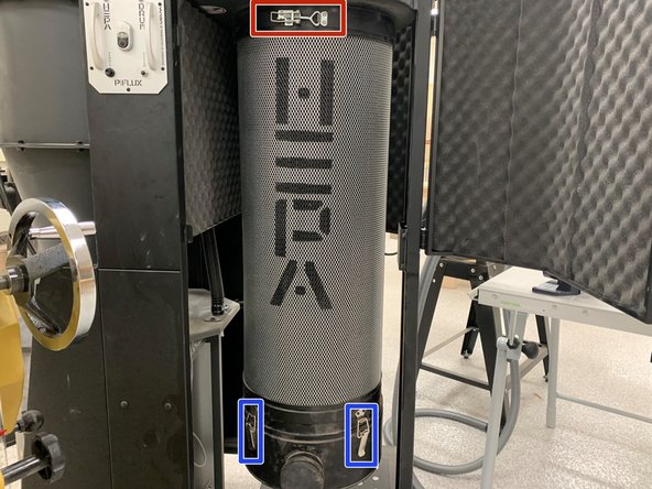 Open the black doors around the waste bin by popping out the handles.