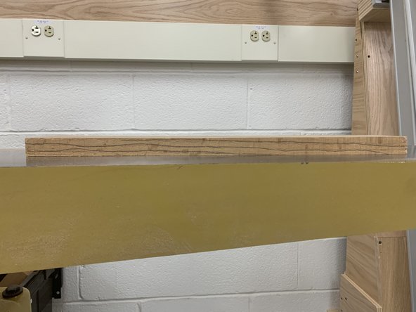 Push board into cutting head.