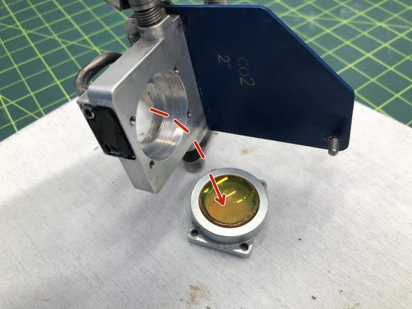 Carefully remove the lens holder