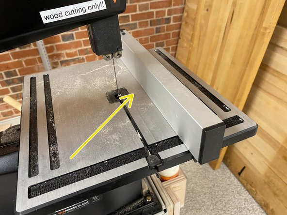 The fences for these band saws are kept on the side of the cart underneath the wood glue.