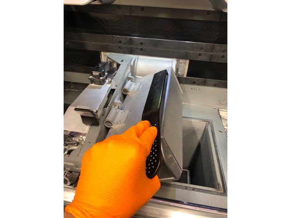 Lift the lamp handle and rotate the lamp to the left, then push to lock it into the cleaning position