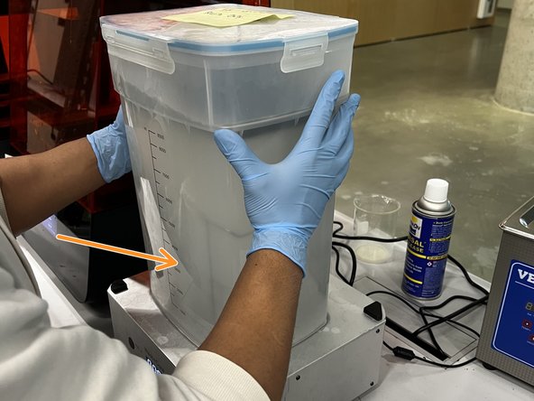 Place the IPA tank (with the build plate inserted) on the Wash+Cure.