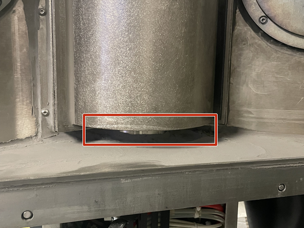 Scrape/ brush the powder from the access door into the recycling container