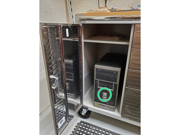 Click the power button once, as depicted by the red arrows and circles.