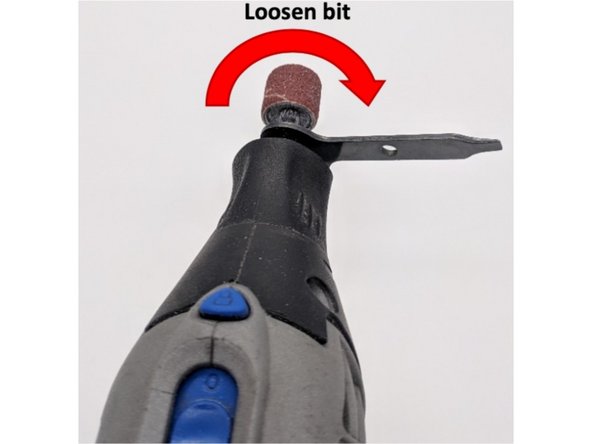 Depress the bit rotation lock and keep it depressed while attempting to rotate the collet