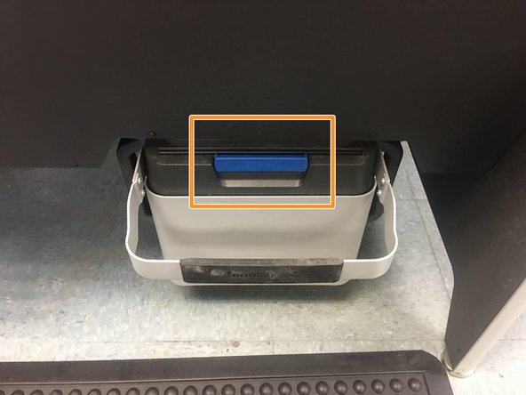 Close the Powder Bin using the blue handle