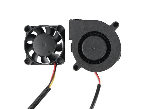 Use tweezers to pull any debris or plastic strands in the hotend fan and part cooling fan.