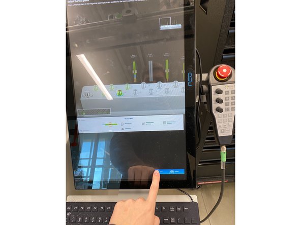 Now insert the tool into the magazine, pushing it down firmly, then selecting okay on the screen saying the tool has been changed.