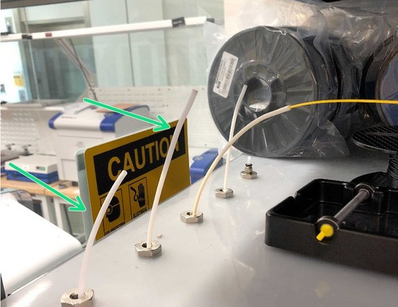 Pull the filament from the PTFE tubes on the 8 ft shelf above the machine