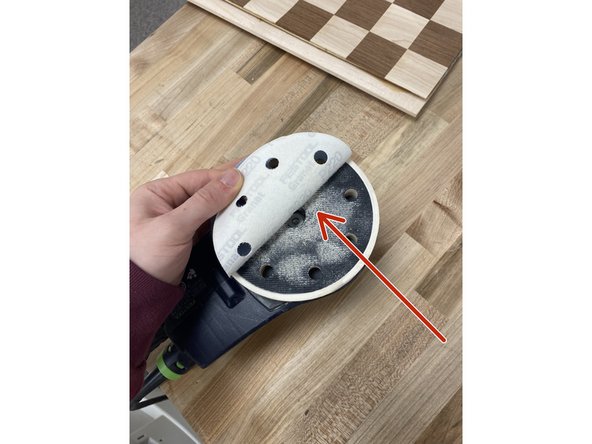 All of the sandpaper sheets for the hand sander have Velcro on the backside of them.