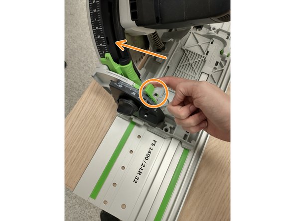 Pull the indicated lever and push the blade to the side.