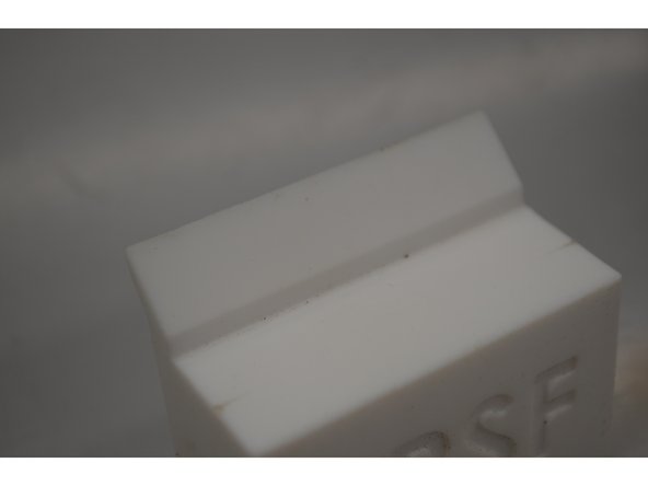 Inspect the purge block for any pock marks or surface irregularities (there should be none), and ensure it can sit flush on its ledge