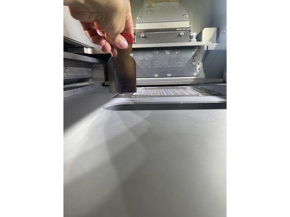 Now the plate is read to be loaded into the machine. Place the plate onto the sintering column and secure it by screwing in the 4 screws and tightening in a diagonal pattern. Tighten the screws so the Allen wrench is beginning to resist you.