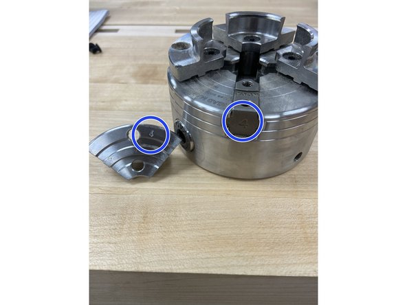 Loosen the jaws of the chuck using the 5/16 hex key. Then remove each piece of the jaws using the small 5/32 hex key.