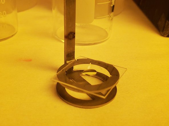 For oil mode prints: Remove the oil on the bottom of the slide by wiping it with a non-woven cloth.