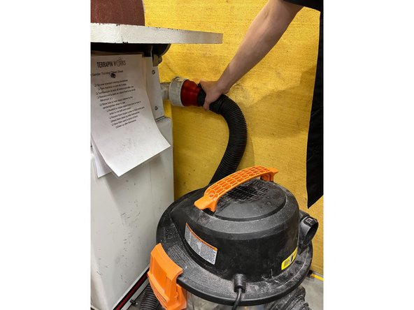 Grab the vacuum attached to the Belt Sander/Disc Grinder