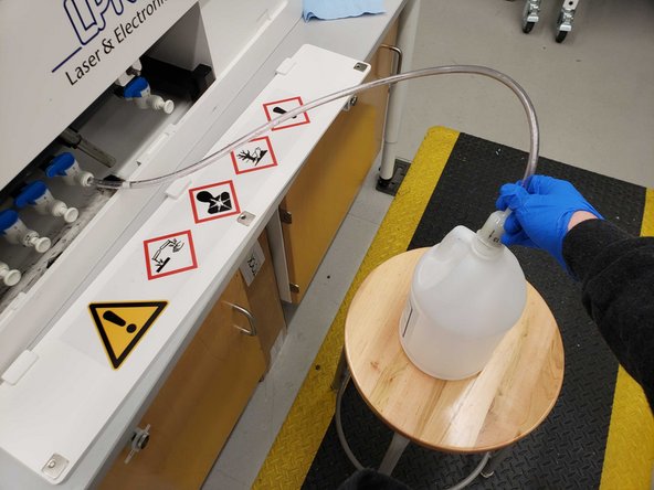 Direct the filter into an empty Copper Plater 400 jug from the back room