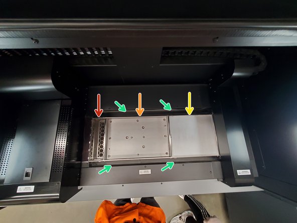 The powder overflow chute and tray directs and filters powder that is spread over the edge of the print area and allows it to fall into the overflow keg