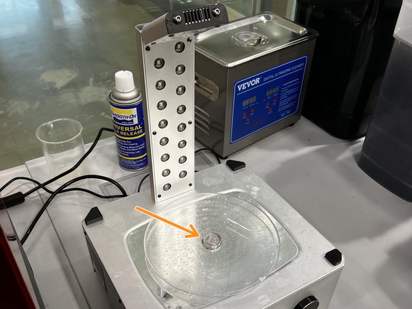 Ensure the rotating base seats into the exposed gear at the center.